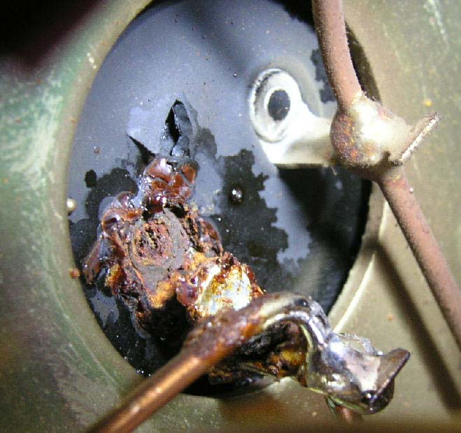 An original electrolytic capacitor from the Musical Fidelity A370 that has vented